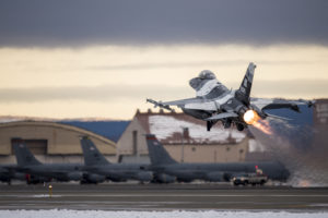 An F-16 Fighting Falcon takes off Oct. 15, 2014, at Eielson Air Force Base, Alaska, during Red Flag-Alaska 15-1. The Pacific Air Forces commander-directed field training exercises for U.S. and partner nation forces provide combined offensive counter-air, interdiction, close air support and large force employment training in a simulated combat environment. The F-16 is assigned to the 18th Aggressor Squadron at Eielson AFB. (U.S. Air Force photo/Senior Airman Peter Reft)